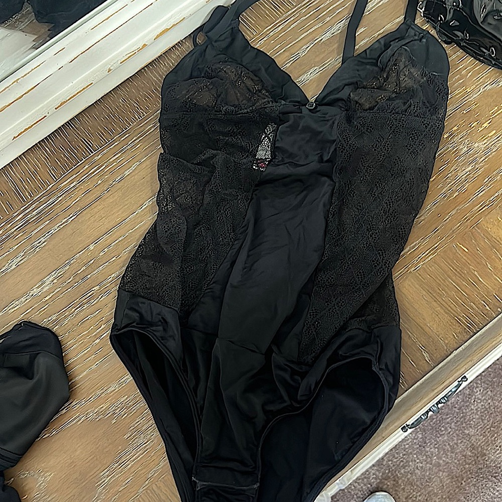 Black 1 piece lingerie. Size small. Snaps at bottom